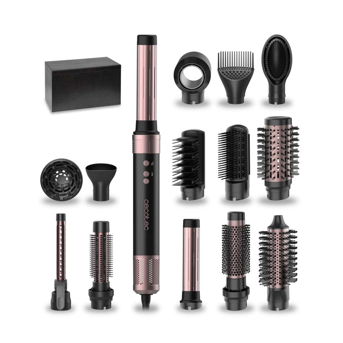 A hair styling tool set on a white background, featuring a central black and rose gold hot air brush with attachments, several round and barrel brushes, a concentrator nozzle, a dryer box, and other styling heads.
