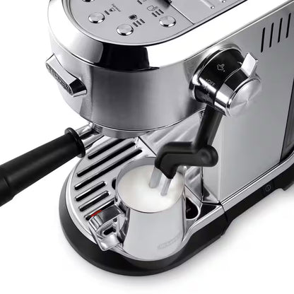 Silver espresso machine with milk frothing attachment on a white background
