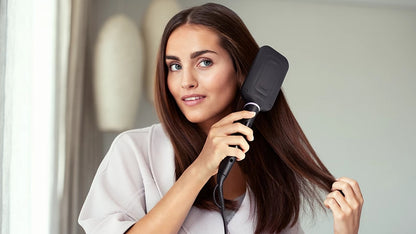 Taghareed StyleCare Essential Heated Straightening Brush with paddle head and purple bristles.