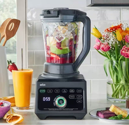 Braun PowerBlend 9 JB9040BK blender with 1600W motor, 3L Tritan jug filled with fruit and ice, ready to make smoothies. Includes a glass of orange juice.