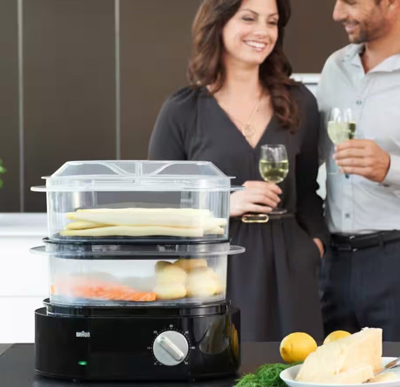 Taghareed Braun IdentityCollection 2-tier food steamer, black, with asparagus, potatoes, and carrots