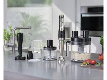 Braun MultiQuick 9 hand blender with stainless steel shaft and 10 accessories on a kitchen counter.