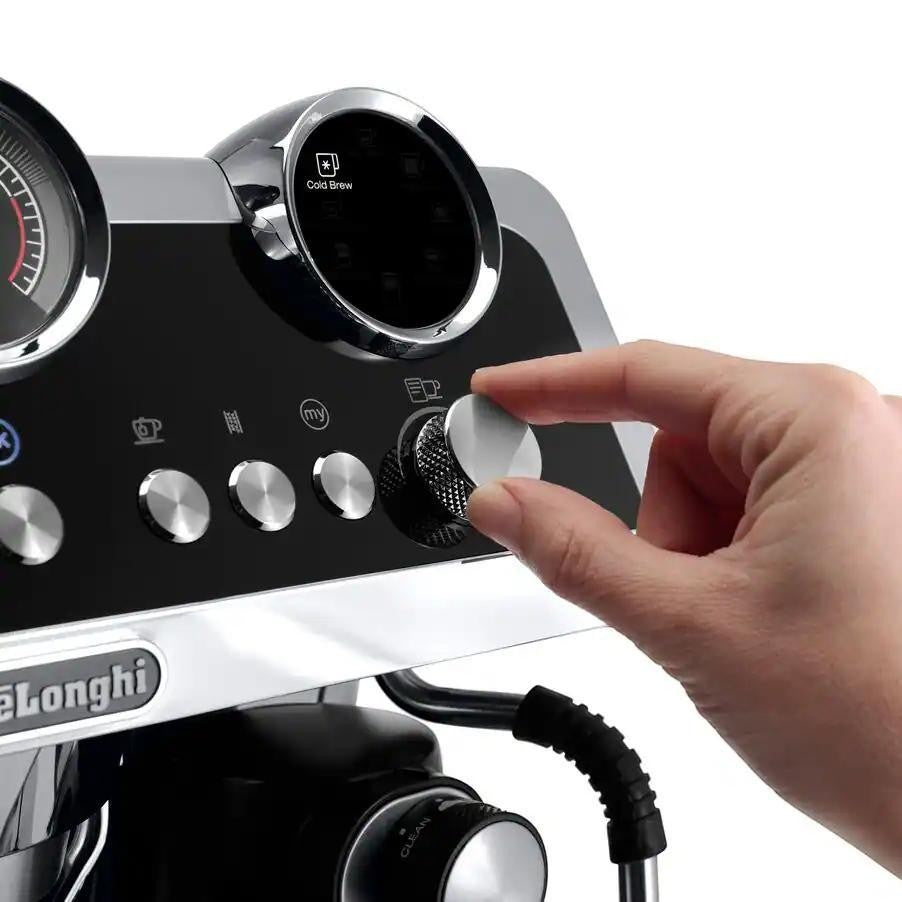 Taghareed De'Longhi La Specialista Maestro espresso machine control panel with a hand turning a dial.