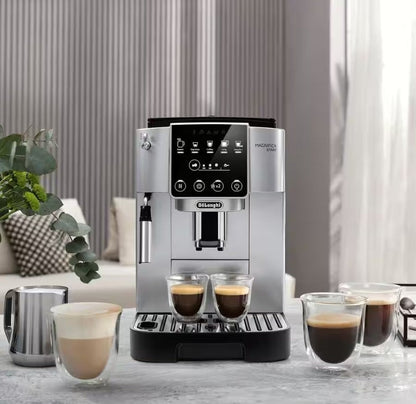 Taghareed De'Longhi Magnifica Start automatic coffee machine in silver with a touch screen and milk frother, brewing two espressos.