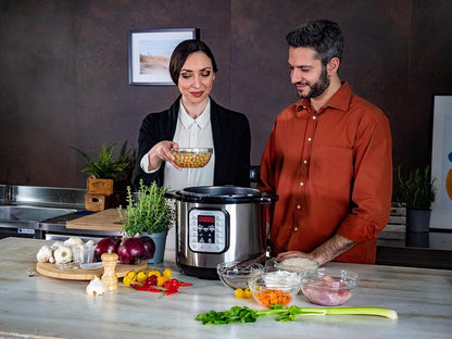 Taghareed Kenwood 16-in-1 electric pressure cooker 8L multicooker PCM80 in silver and black with digital display and 16 smart programs.