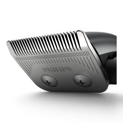 Taghareed Philips Hairclipper Series 3000 HC3100/13 close-up of stainless steel blades with comb attachments.