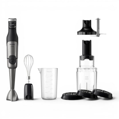 Taghareed Philips 5000 Series hand blender in silver and black with whisk, chopper, beaker, and food processor attachments.
