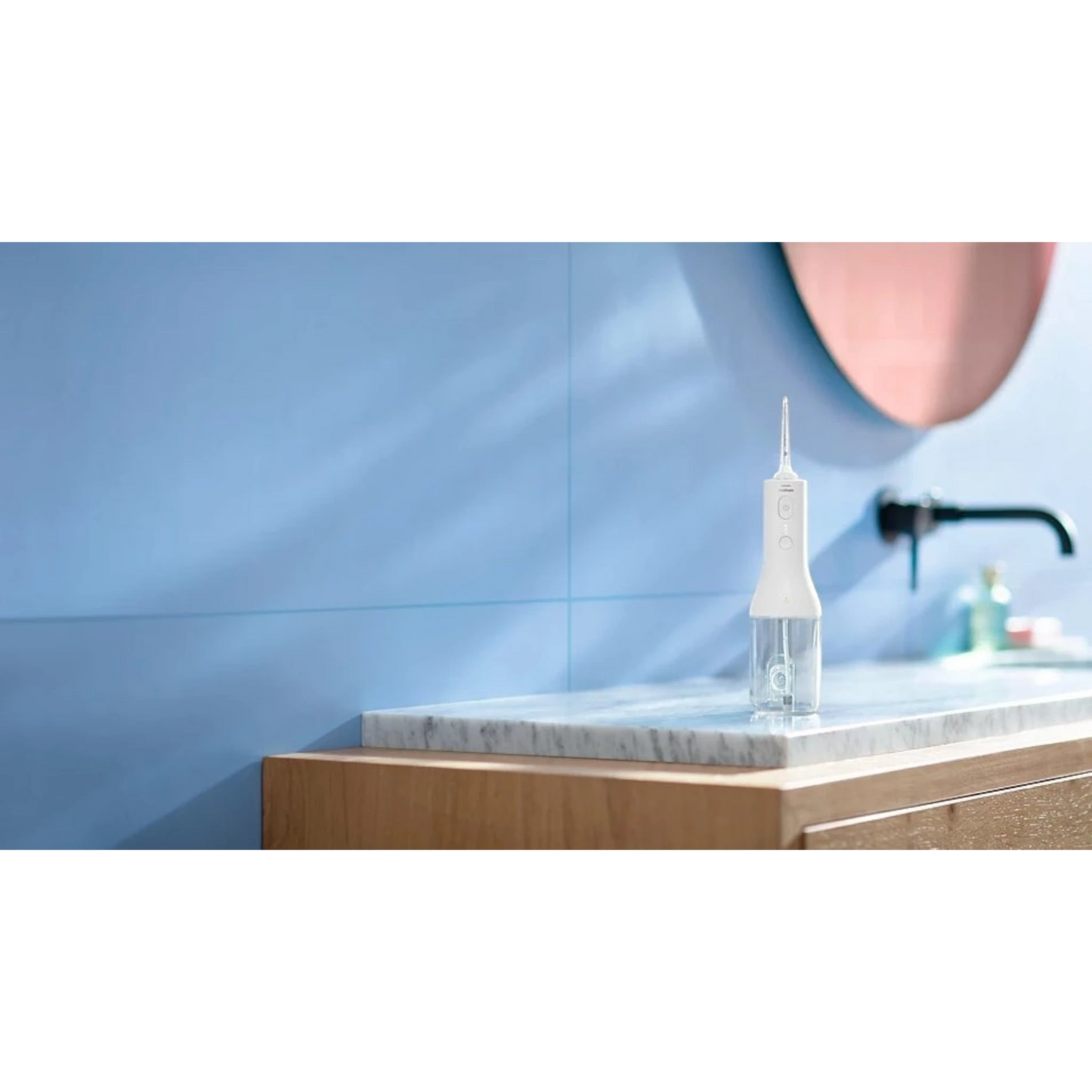 Taghareed Philips Sonicare Cordless Power Flosser 2000, white, with two cleaning modes for effective oral hygiene.
