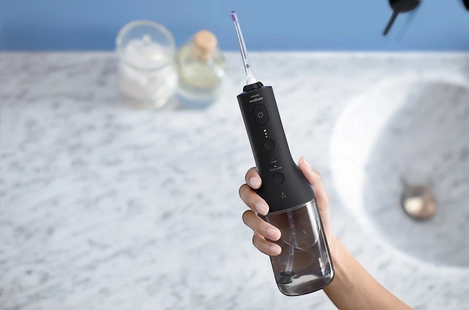 Taghareed Philips Sonicare Cordless Power Flosser 3000 HX3826/33, black, with 3 modes for oral hygiene.