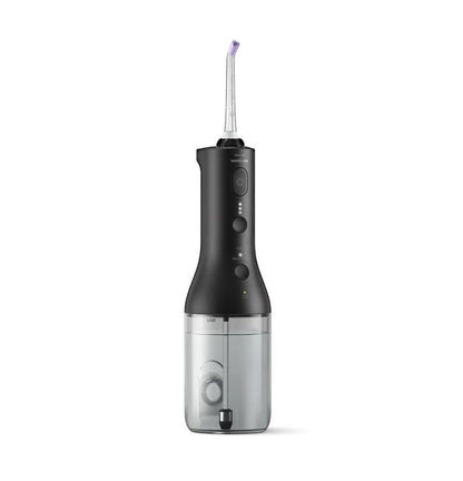 Taghareed Philips Sonicare Cordless Power Flosser 3000 HX3826/33 in black, with 3 modes for oral hygiene. Features a water reservoir and nozzle.