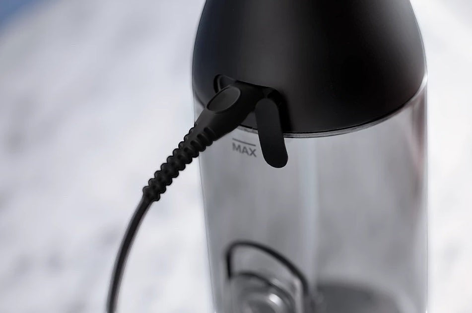 Taghareed Philips Sonicare Cordless Power Flosser 3000 HX3826/33 charging port with black cord connected.