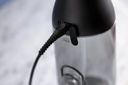Taghareed Philips Sonicare Cordless Power Flosser 3000 HX3826/33 charging port with black cord connected.