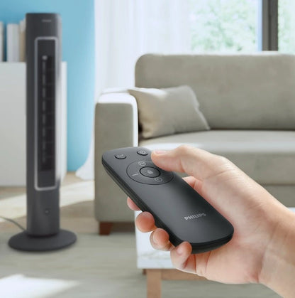 Taghareed Philips 5000 Series Tower Fan CX5535/11, dark grey, slim design, remote control in hand